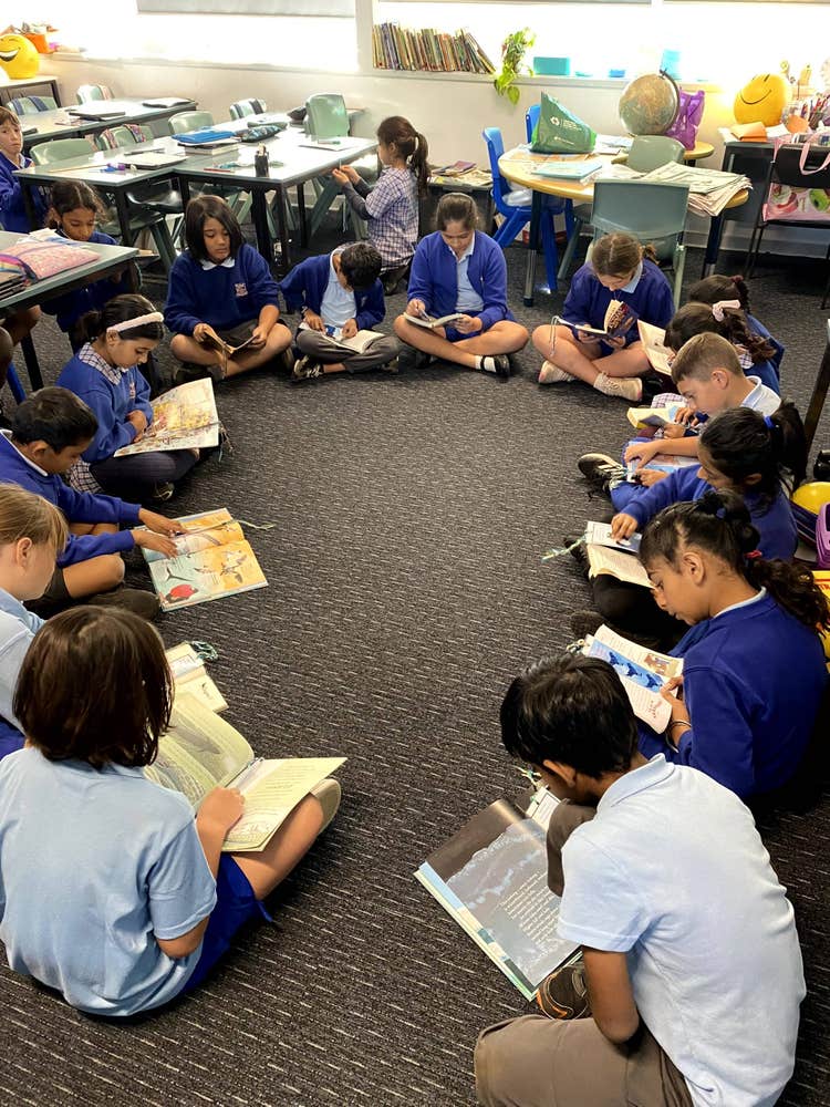 Large group of students reading